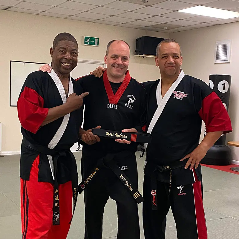 Black belt grading ceremony at a martial arts classes in Cheltenham school