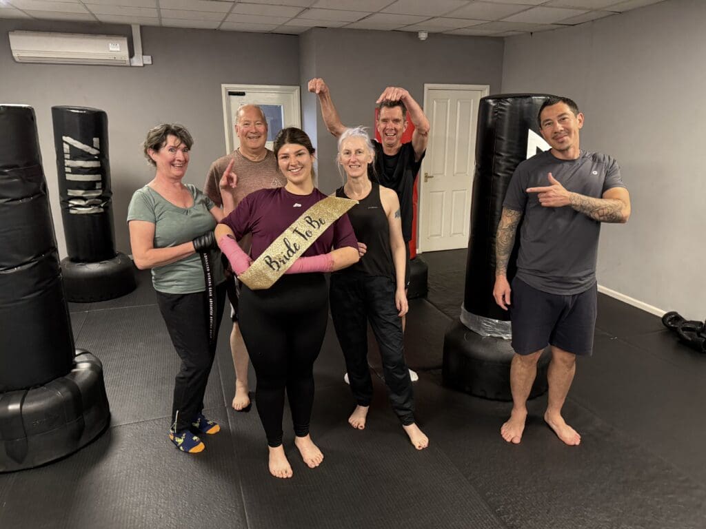 Fitness kickboxing class group at martial arts school in Cheltenham