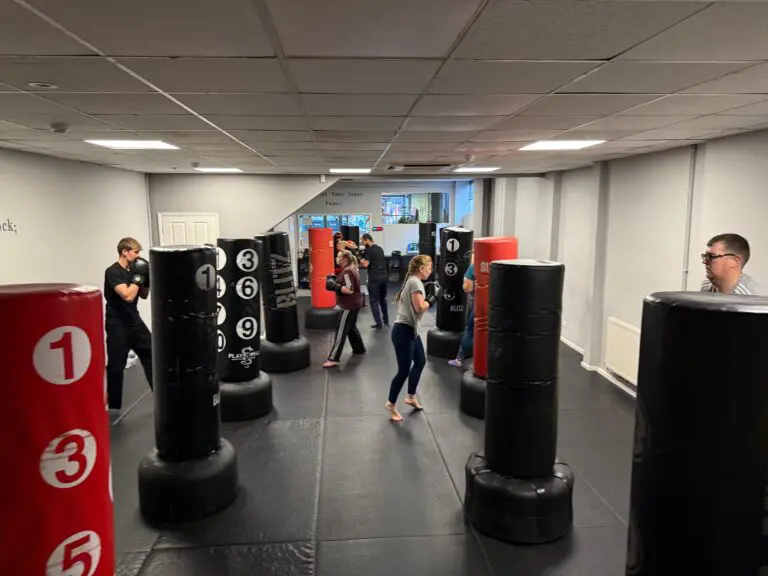 Fitness kickboxing class community training together in Cheltenham